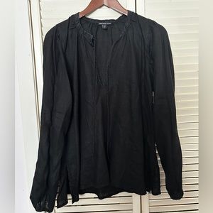 100% linen black colour, lovely for summer weather.